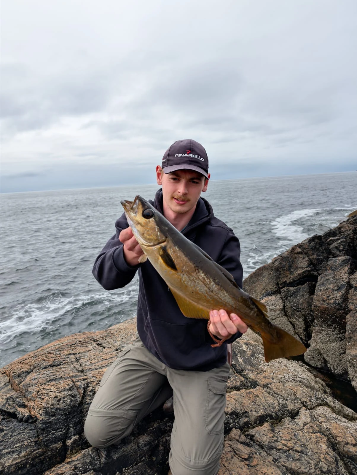 Glen Meighan with a Pollack caught on a white shad in the North West Highlands