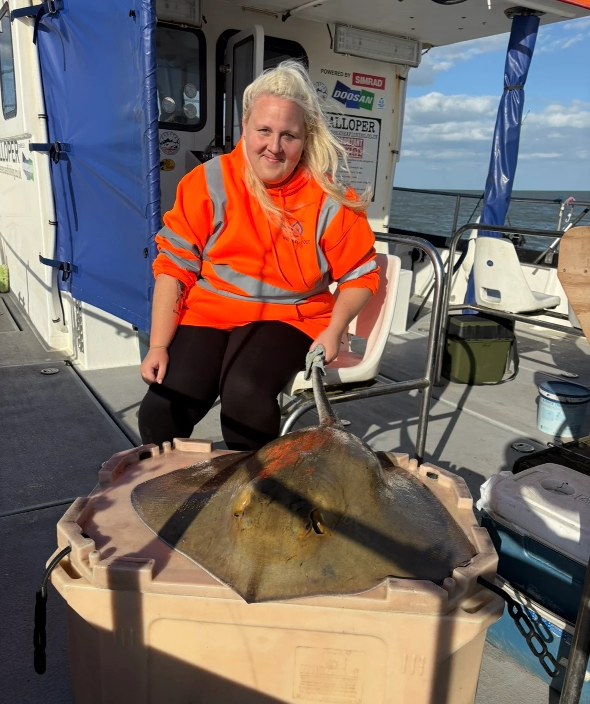 Katy Dunn with a Stingray caught aboard The Galloper