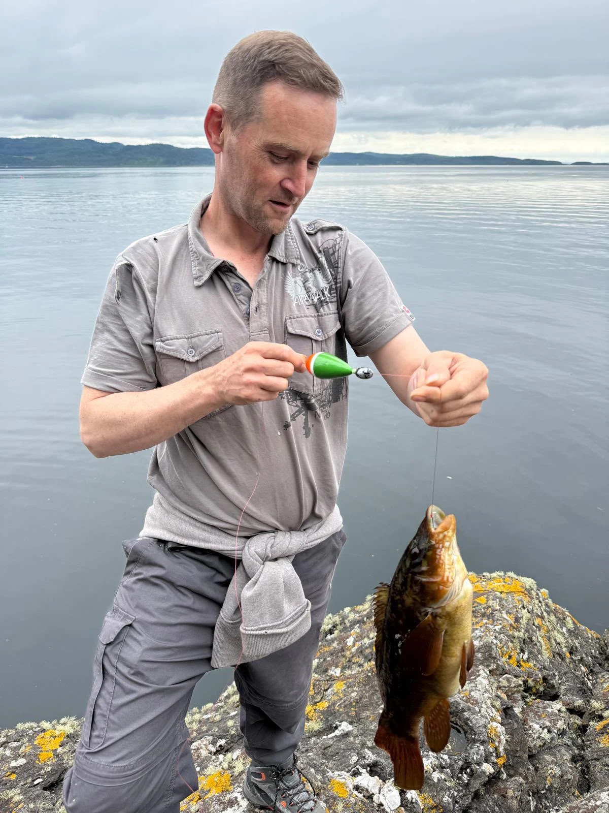 Thomas Davidson with a Ballan Wrasse caught on float and ragworm off the rocks at Loch Fyne
