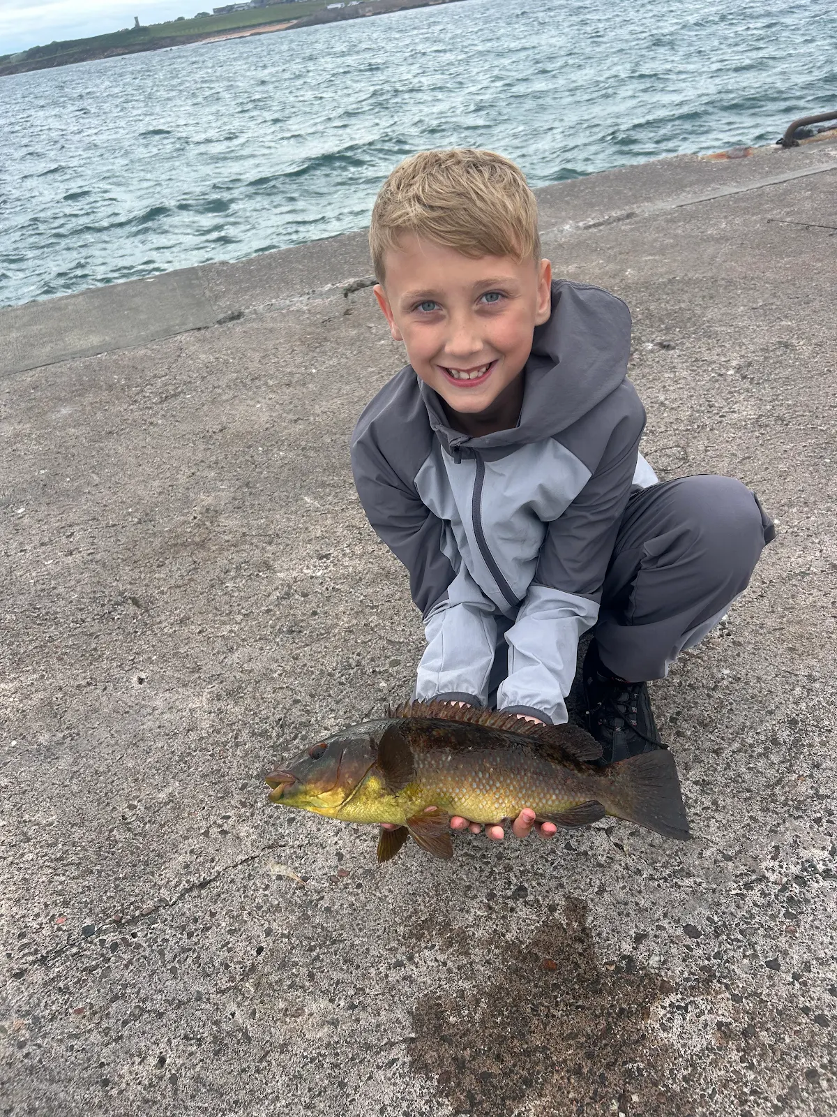 Brody Stevenson with a Wrasse caught on lugworm off Anstruther harbour