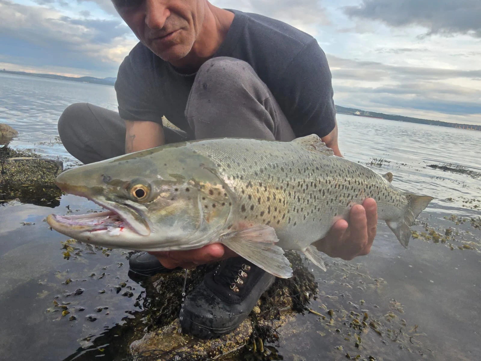 James Saunders with a Sea Trout caught on a metal lure just under the surface in the Forth Estuary
