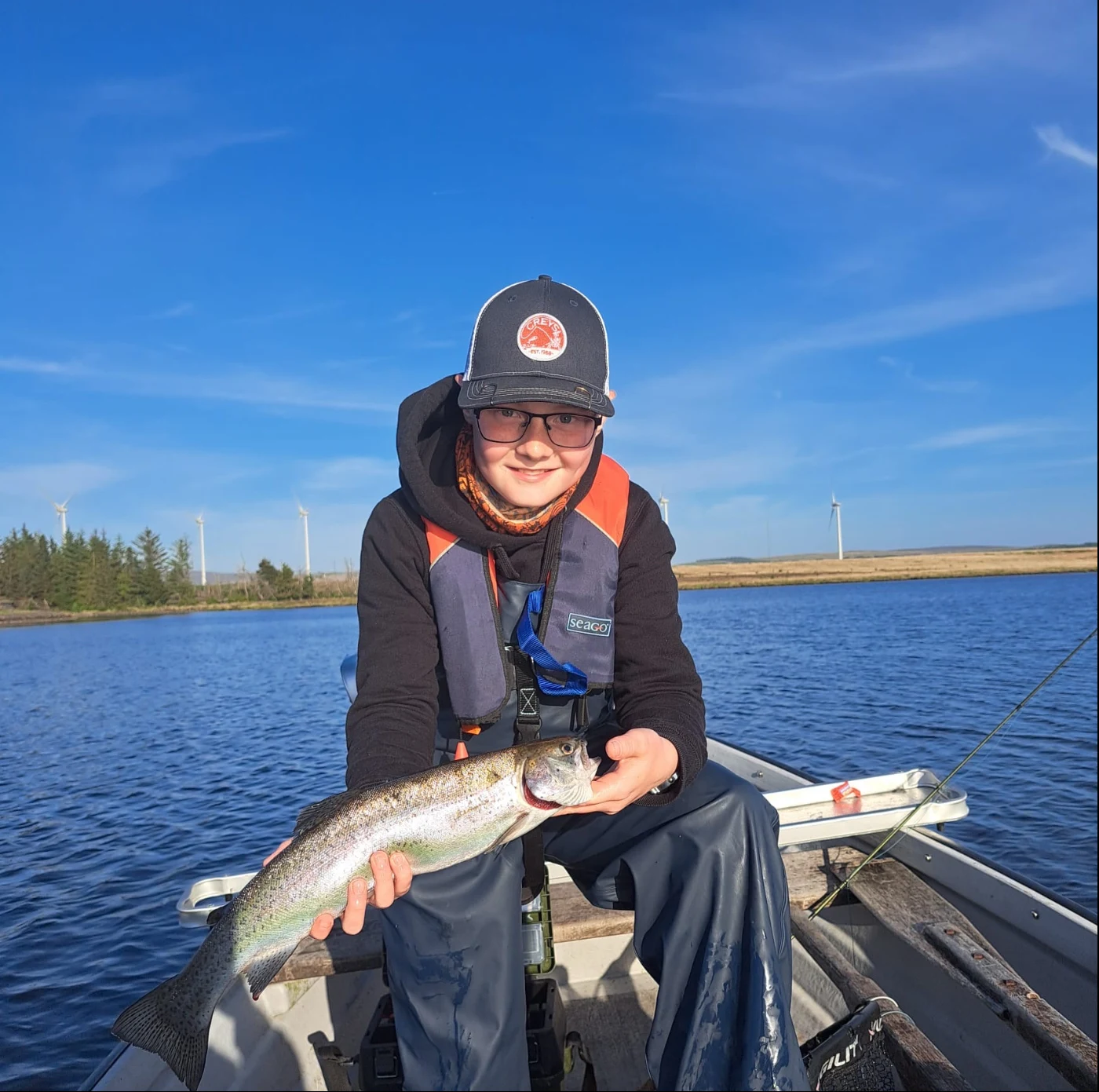 Lewis Brenchley with a Rainbow Trout caught on a Woofta Booby at Cobbinshaw Loch