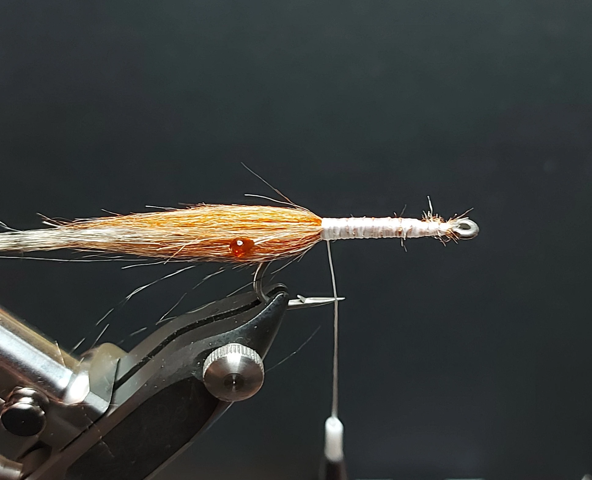 Brown and grizzly streamer fur tied around the hook